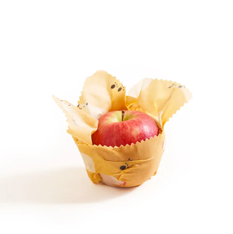 Beeswax food wraps with an apple inside