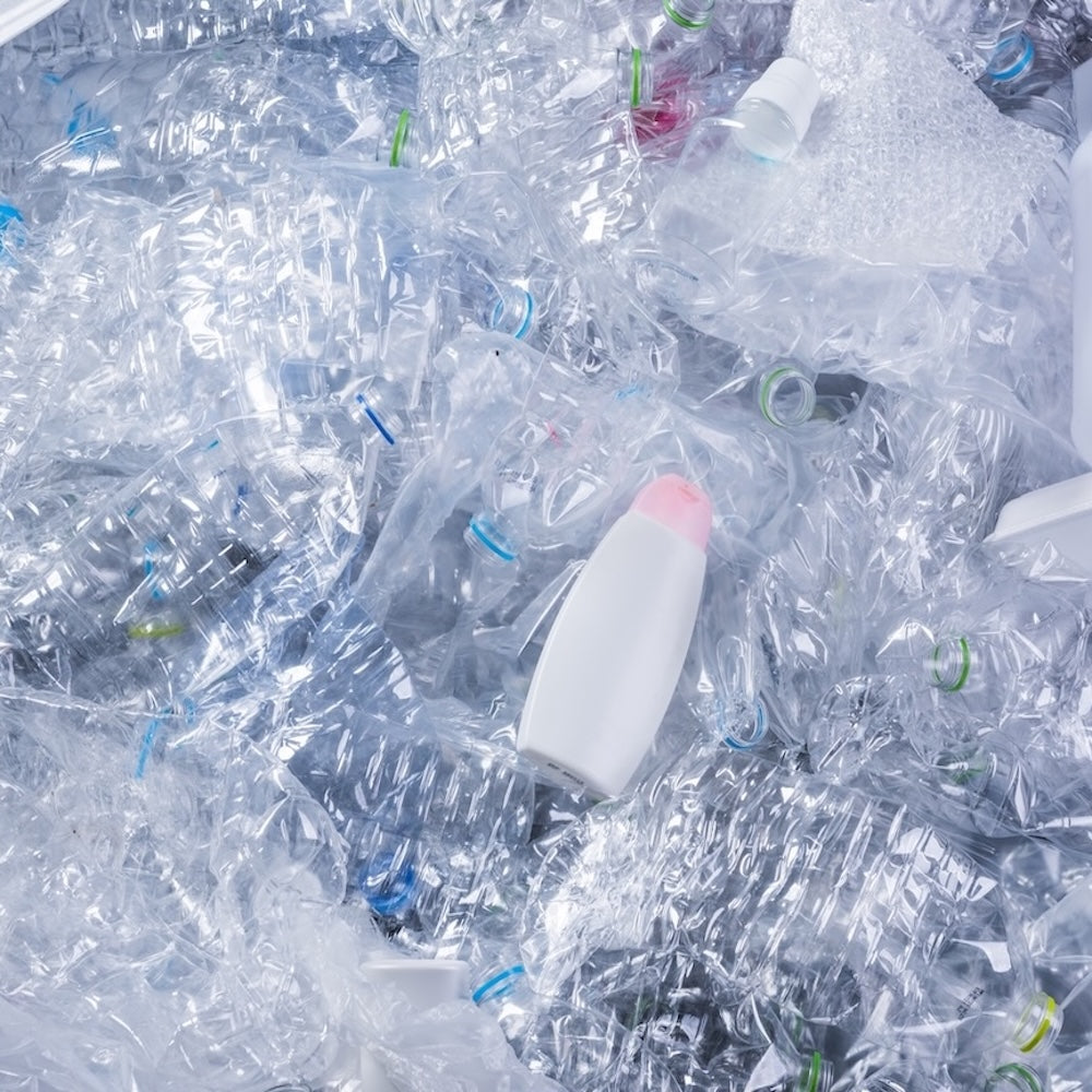 Plastic packaging tax 2026 - waste plastic products piled up together