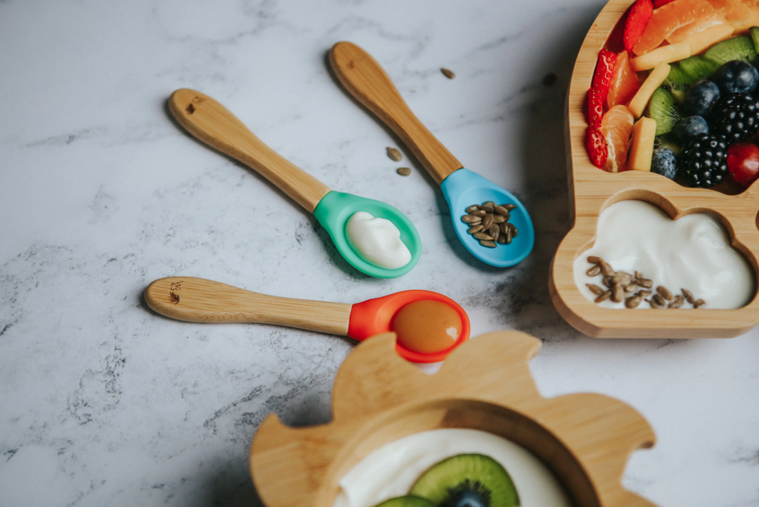 Baby silicone spoon with food on
