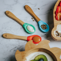 Baby silicone spoon with food on